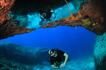 Fotobehang Scuba diver explores coral reef © Richard Carey