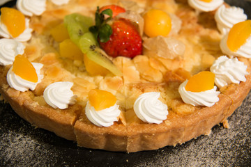  peach pie with  peaches  on top whipping cream