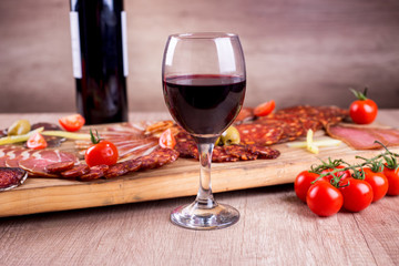 Red wine and smoked meat delicatessen