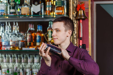The bartender making cocktail