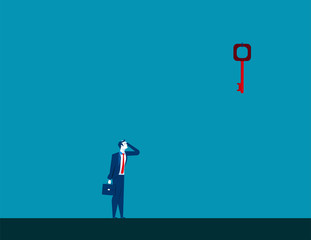 Obraz premium Businessman looking up at key high up in wall