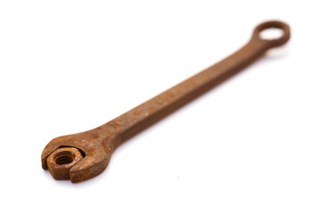 rusty nut and spanner on a white background