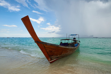 Traditional Thai boats carrying tourists on the nearby islands