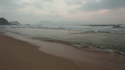 A misty morning coastline scene looking out over the south China sea in Vung Lam Bay Vietnam.