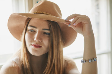 Woman in beige hat