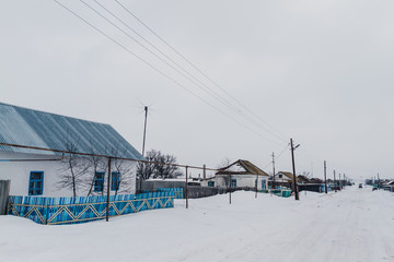 Snowy winter in village.