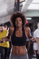 black woman doing parallel bars Exercise