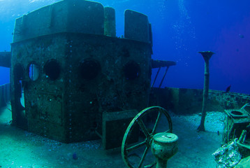 the helm of the kittiwake is now exposed since a storm blew the structure of the wheelhouse away. The wheel and controls can now be seen by snorkelers as well as divers © drew