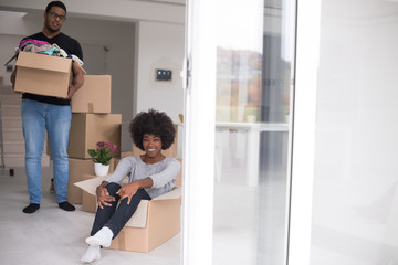 African American couple  playing with packing material