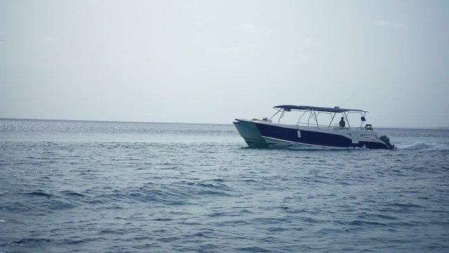 White boat in the ocean during the calm