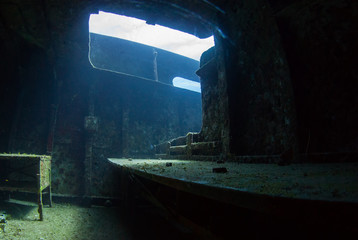 The inside of a room in a sunken shipwreck. The shot was taken with natura light to create an eerie...
