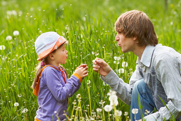 father and daughter for a walk summer day