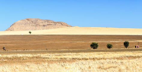 Landscape in The Namib-Naukluft National Park. Namib-Naukluft is a national park of Namibia encompassing part of the Namib Desert (considered the world's oldest desert) and the Naukluft mountains.