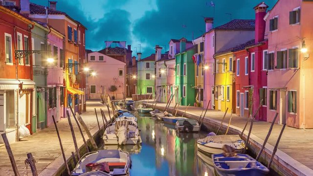 Canal and colorful houses in the evening on Burano Island, Venice, Italy (static image with animated sky and water)
