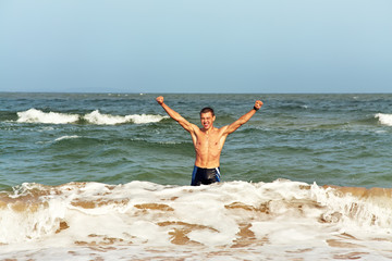 man standing in the sea