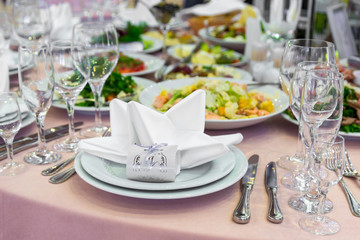 catering table set service with silverware, napkin and glass at restaurant before party