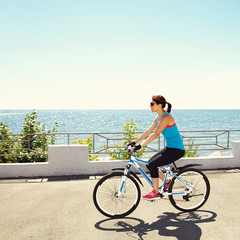 Fototapeta premium Young woman and bike