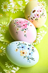 Easter decorated eggs with romantic flower ribbon