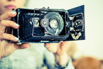 Vintage Photo Camera in Hands