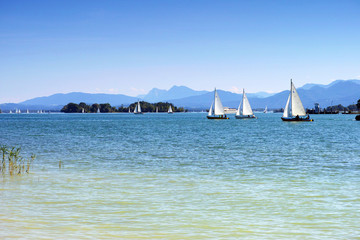 Floating yachts on lake Chiemsee