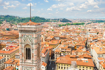 Fototapeta na wymiar bell tower of cathedral church Duomo Santa Maria del Fiore and cityscape of Florence, Italy