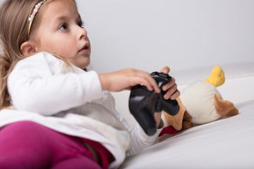 Little girl with joystick © Giulio_Fornasar