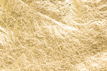 Gold wrinkled paper texture abstract background