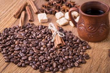 grains of black coffee on the wooden table