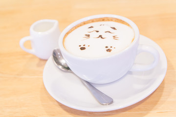 Cat latte on the table / hot coffee