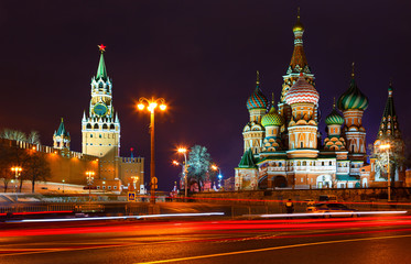church and towers of Kremlin at night. view from Bolshoi Zamoskvoretsky bridge. Tracers from cars. Police car.