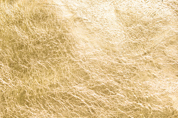 Gold wrinkled paper texture abstract background