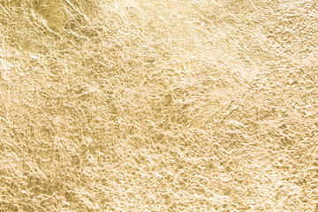 Gold wrinkled paper texture abstract background