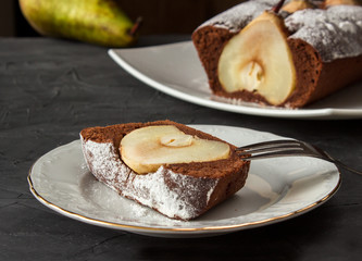 Whole Chocolate cake with pear and one piece of it