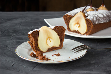 Whole Chocolate cake with pear and one piece of it
