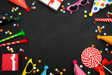 Fototapeta na wymiar birthday black background with sweets and decorations