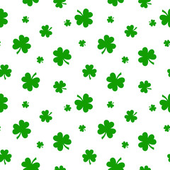 Vector St. Patrick's day seamless pattern with green shamrock leaves on a white background.