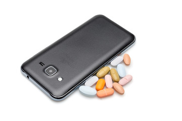 Phone and pills on a white background