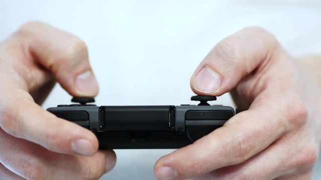 Video Gamer Holding A Controller And Playing Video Games