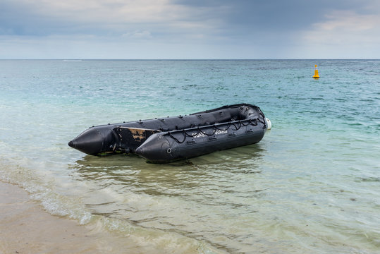 Coastguard's dinghy on the shores of the Indian ocean on a cloudy day