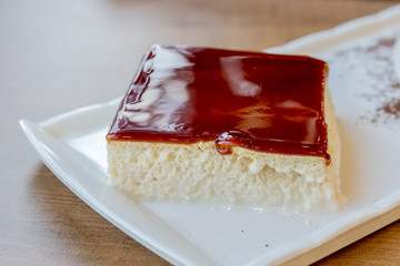 Milk dessert with caramel trilece served on a plate