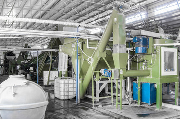 factory equipment for processing and recycling of plastic bottles. PET recycling plant