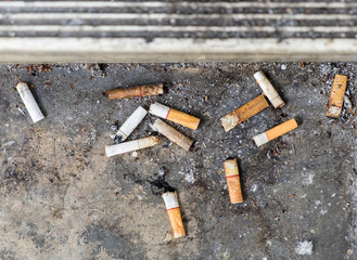 Cigarette butt a lots disgusting dirty discarded