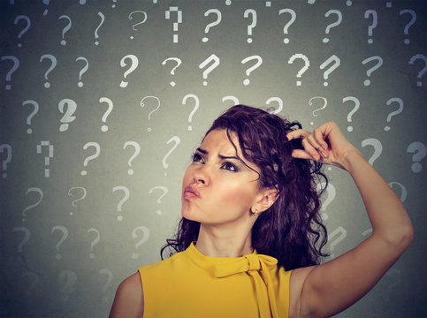 confused thinking woman scratching head has many questions