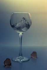 Splash water in a glass on a gray
