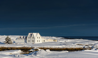 Farm house in the snow, on the road from Reykjavik to Keflavik - breathtaking Iceland in winter - amazing landscapes, storms and blizzards - photographers paradise