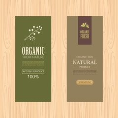 set of natural label and organic label green color on wood texture. vintage labels and badges design.