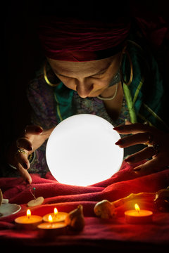 Crystal ball for fortune telling and hands of gypsy fortune teller