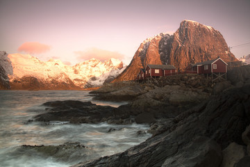 Fisherman houses under the mountain near the shore