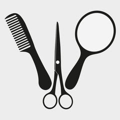 mirror scissors and comb on white background