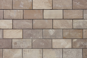 Background pattern of natural stone bricks beige